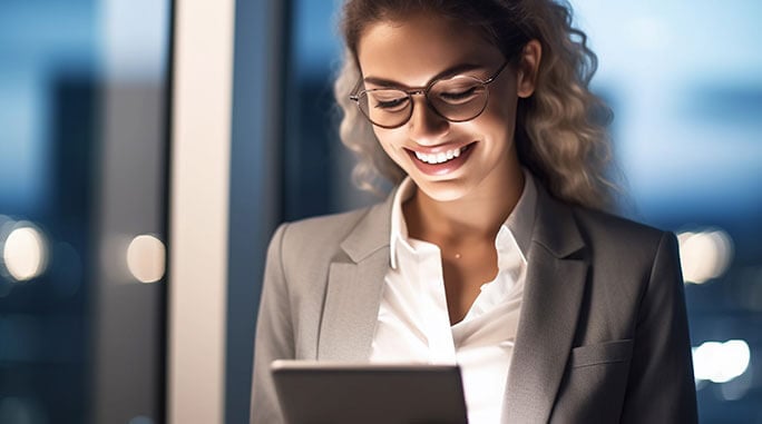 woman looking at tablet