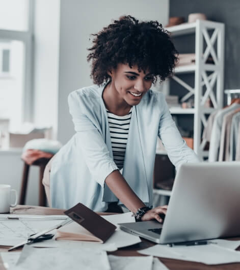 A female entrepreneur engaged in email correspondence on her laptop