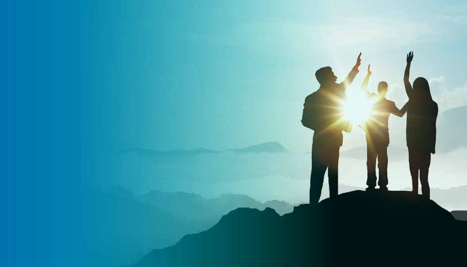 group standing on a hill high fiving