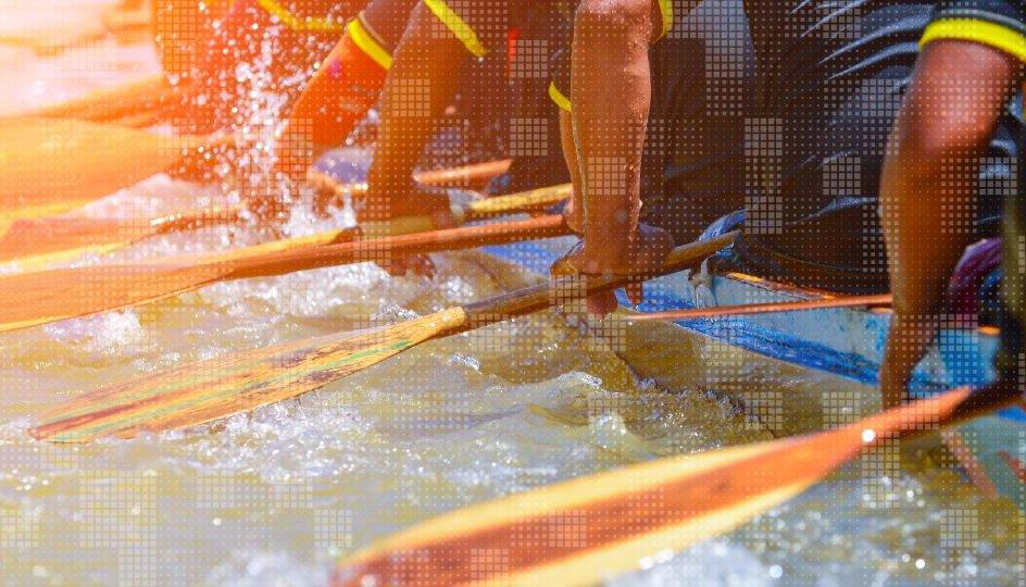 A rowing team synchronized in a competitive race on the water, enhanced with a modern color-tone filter effect, serving as a powerful metaphor for teamwork, leadership, and shared business goals.