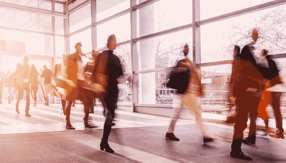 Blurred people walking inside the building